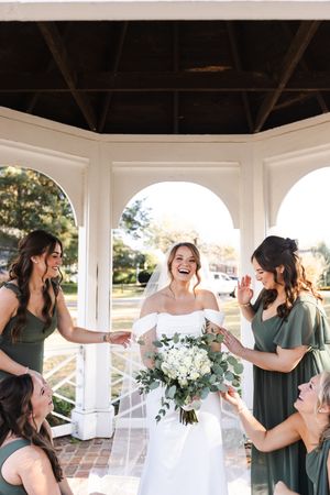 A series of joyful candid moments captured in a white gazebo with bridesmaids in sage green dresses and white flowers.