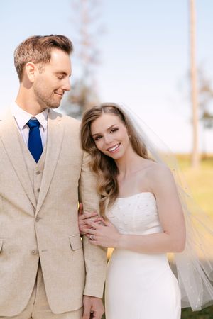 A romantic wedding photo series showing a couple in beige suit and white dress against a soft background.