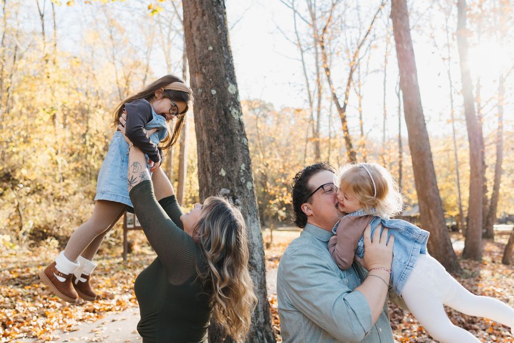 Fall family photo with parents and children surrounded by autumn leaves in Canonsburg, Pennsylvania