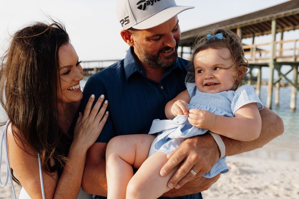 Joyful family captured on the beach during golden hour