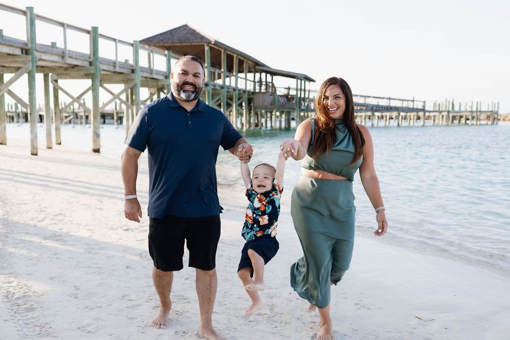 Smiling family enjoying a sunny day at the beach