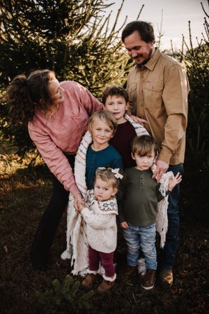 Candid outdoor family photo Christmas tree farm - middle tn clarksville tn Nashville family photographer specializing in natural light