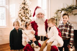 Children visiting with Santa Claus Nashville family photographer specializing in natural light, candid storytelling, and timeless portraits.