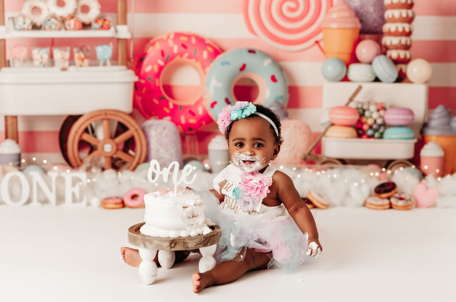 One year milestone photography in Magnolia Texas with themed cake smash setup