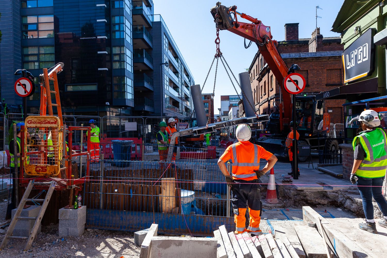 Construction photograph of barriers being lifted into position
