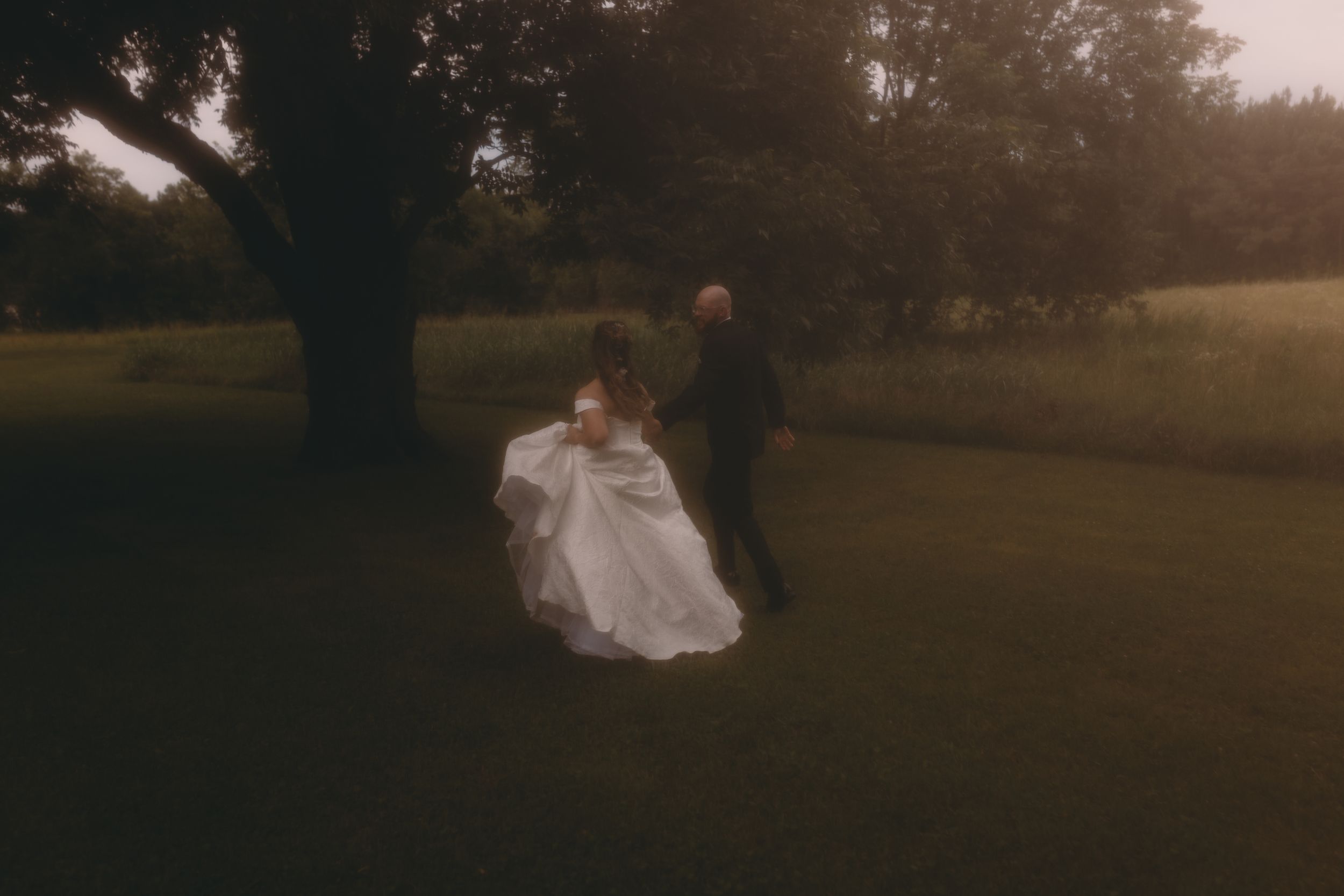 Bride and groom in artistic photo at a wedding in North Alabama photographed by White Oaks Photography.
