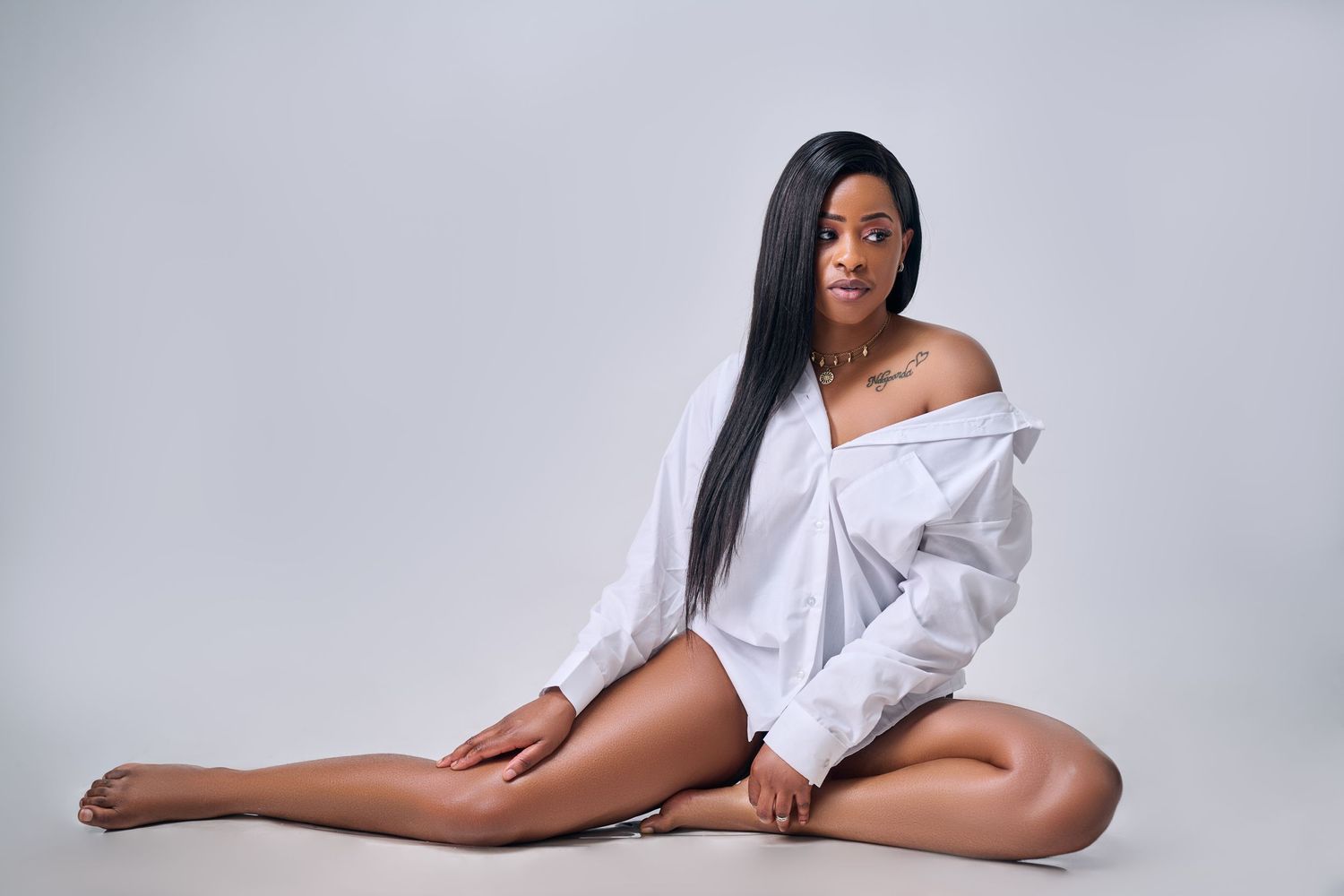 a lady posing n a white shirt