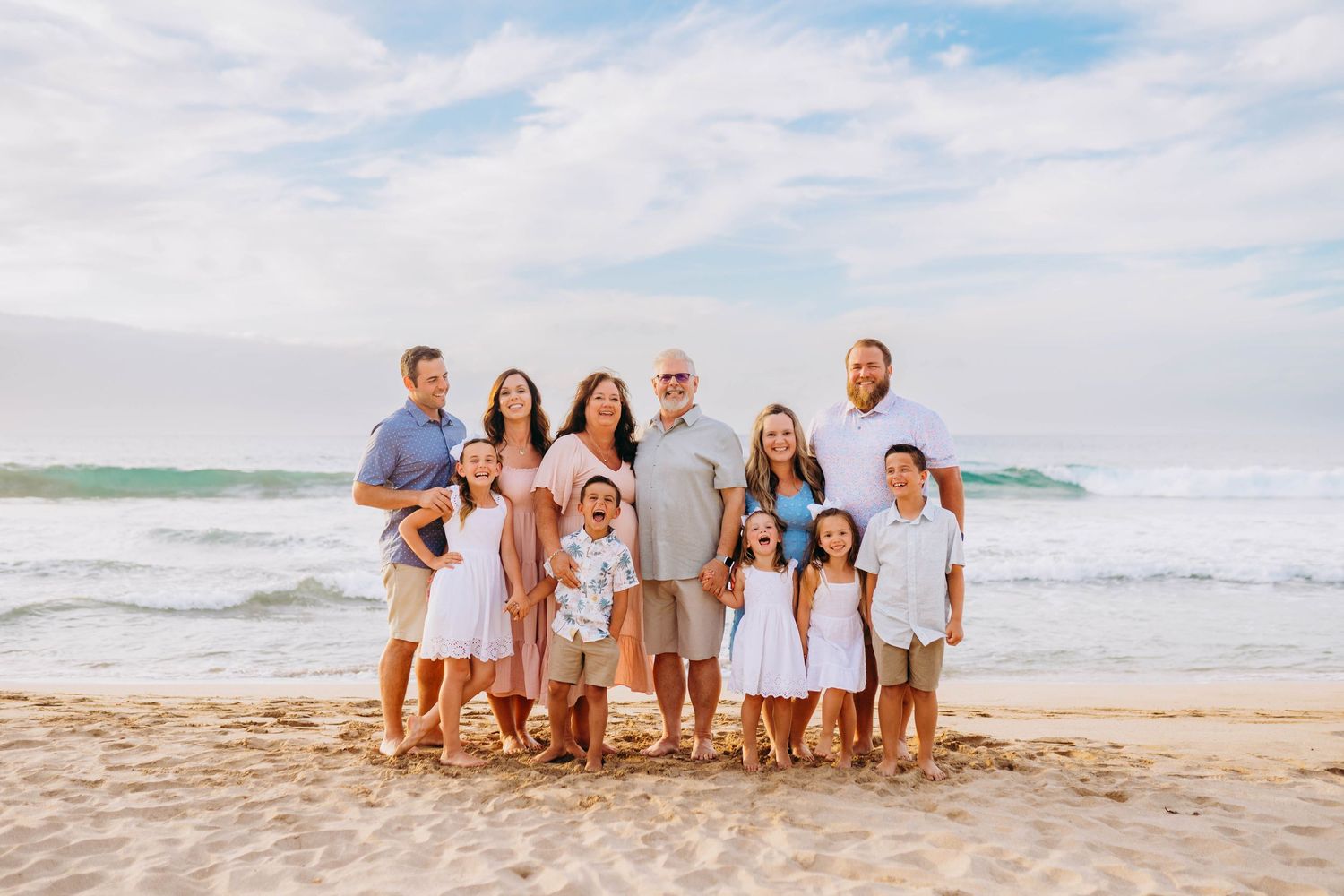 Extended family group photo session on a sandy beach at sunset. best hawaii family photographer kihei wailea kaanapali makena