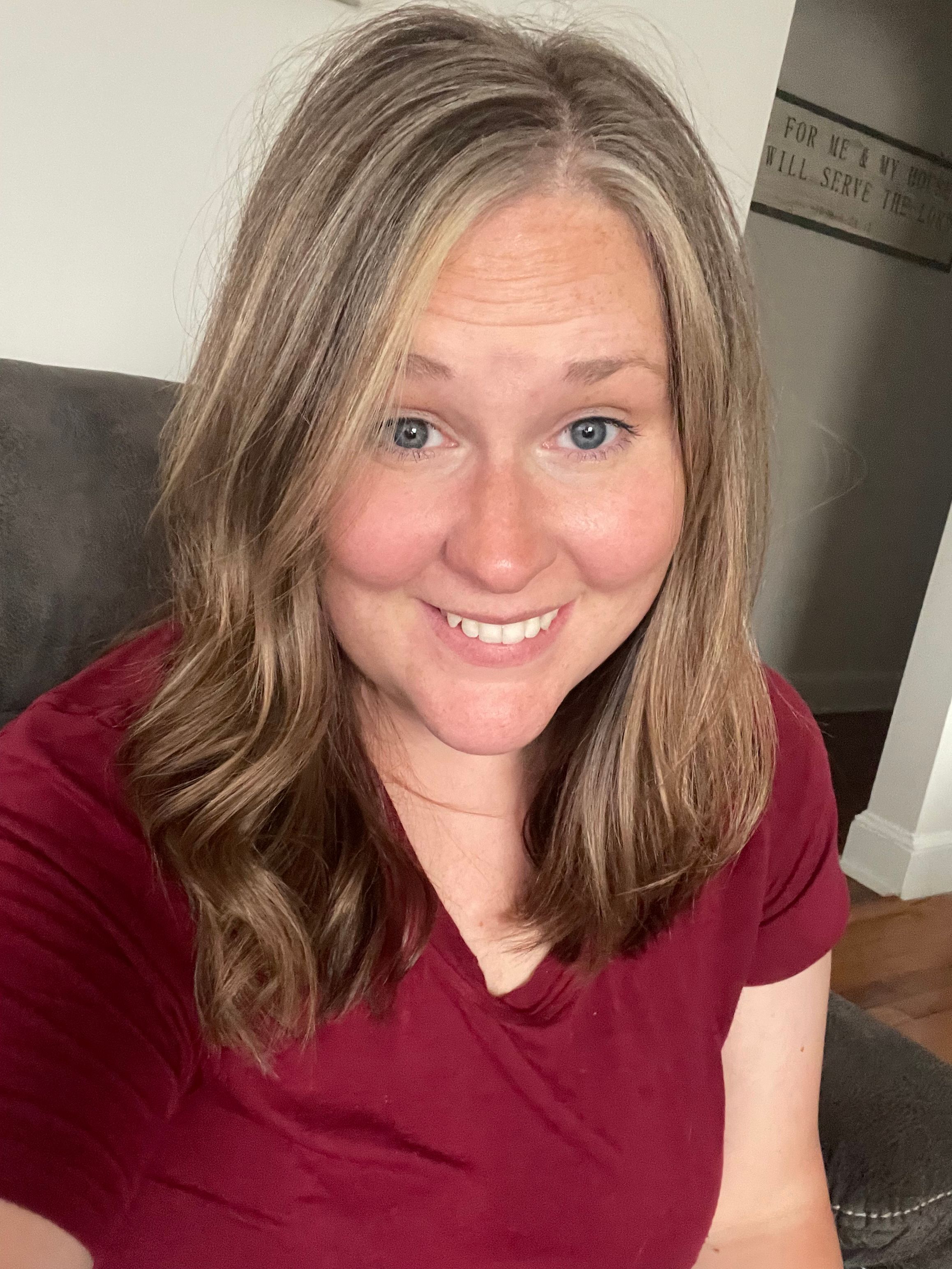 woman looking at the camera smiling for a photo