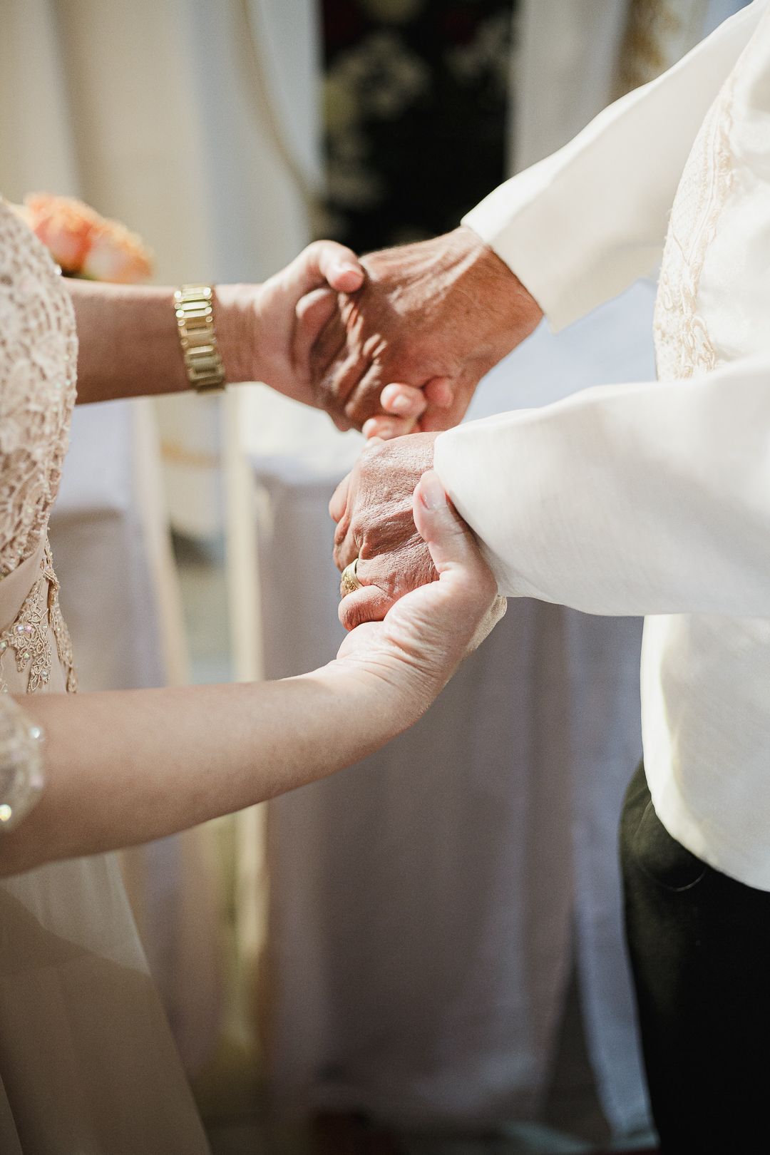 a couple during their wedding shoot, holding hands