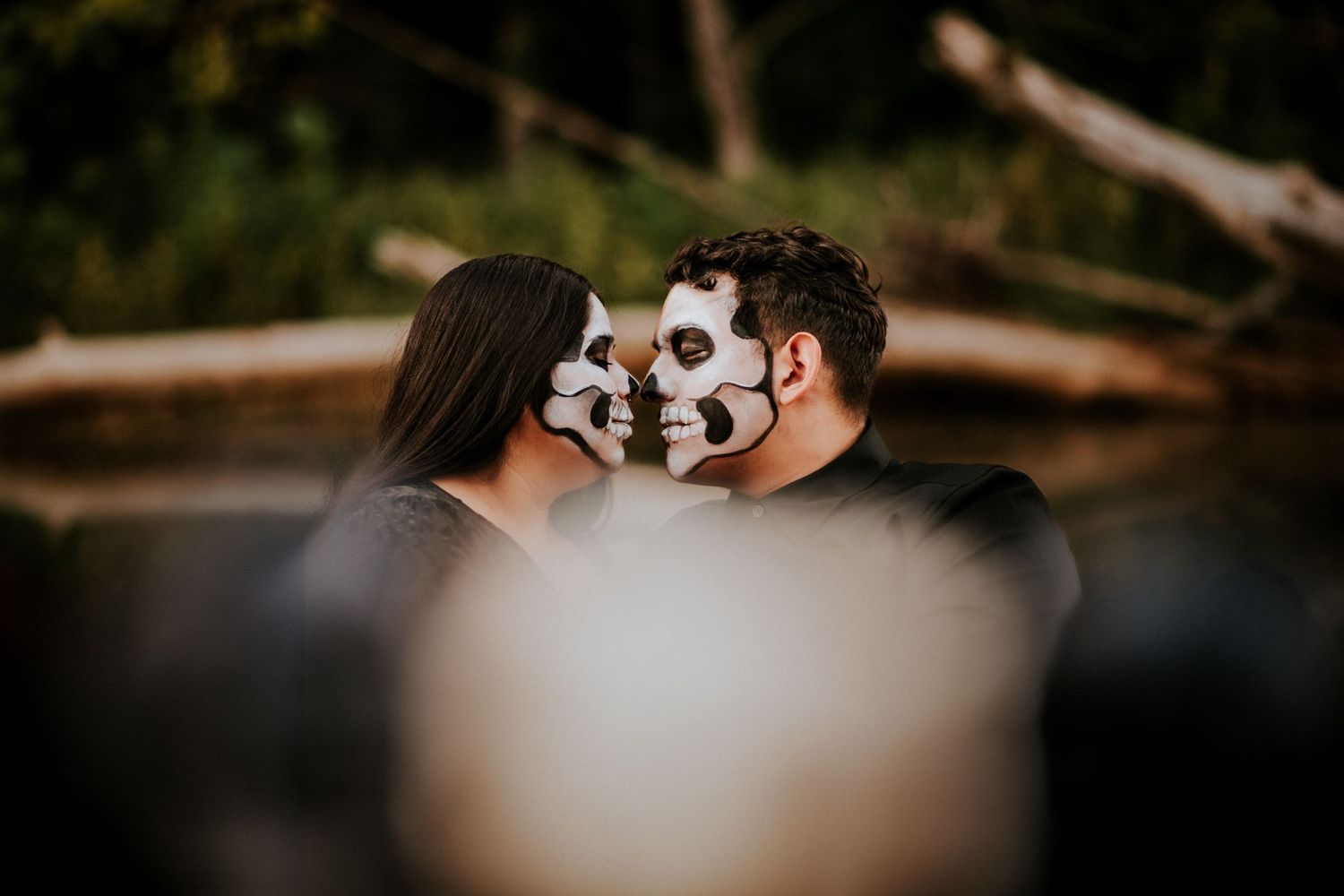 Day of the Dead shoot of a couple with skull face painting on a boat in a lake in Fort Campbell, Tennessee.