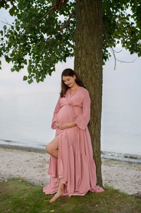 outdoor portrait of pregnant mother in pink dress outdoor maternity session Cobourg beach, Ontario*