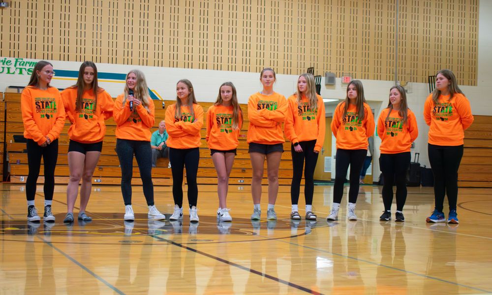 Prairie Farm Wisconsin Cross Country team 2024 standing next to each other at their Pep Rally.