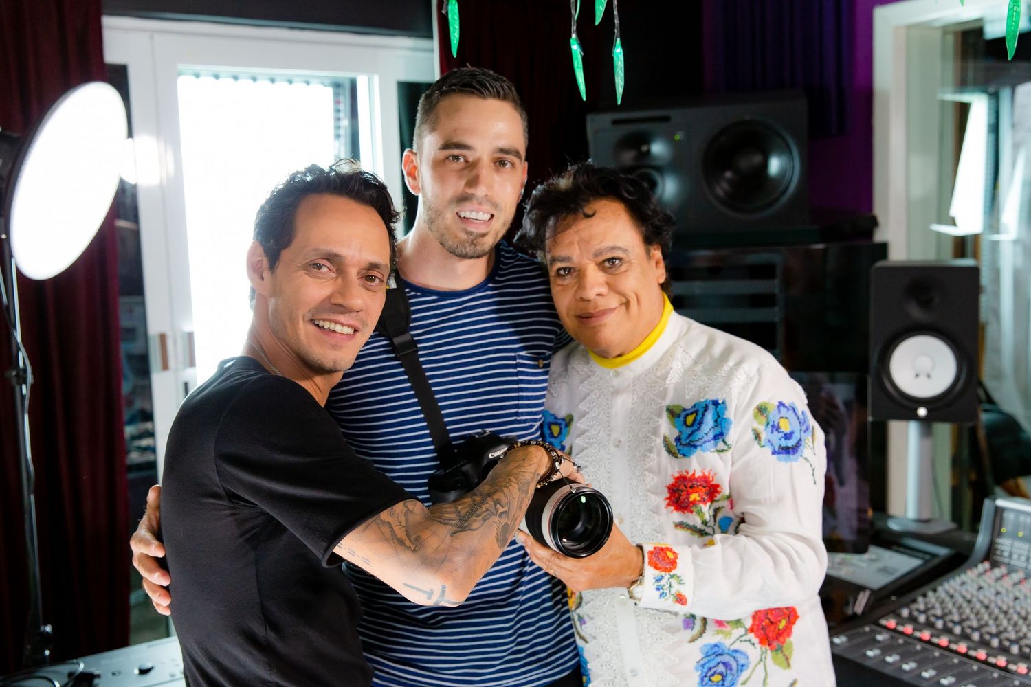 Marc Anthony, Robert Hacman and Juan Gabriel in a recording studio.