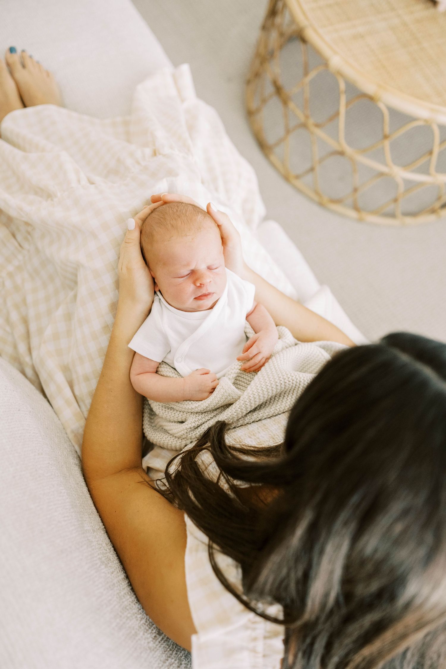 In-home newborn photographer capturing natural family moments in Frisco