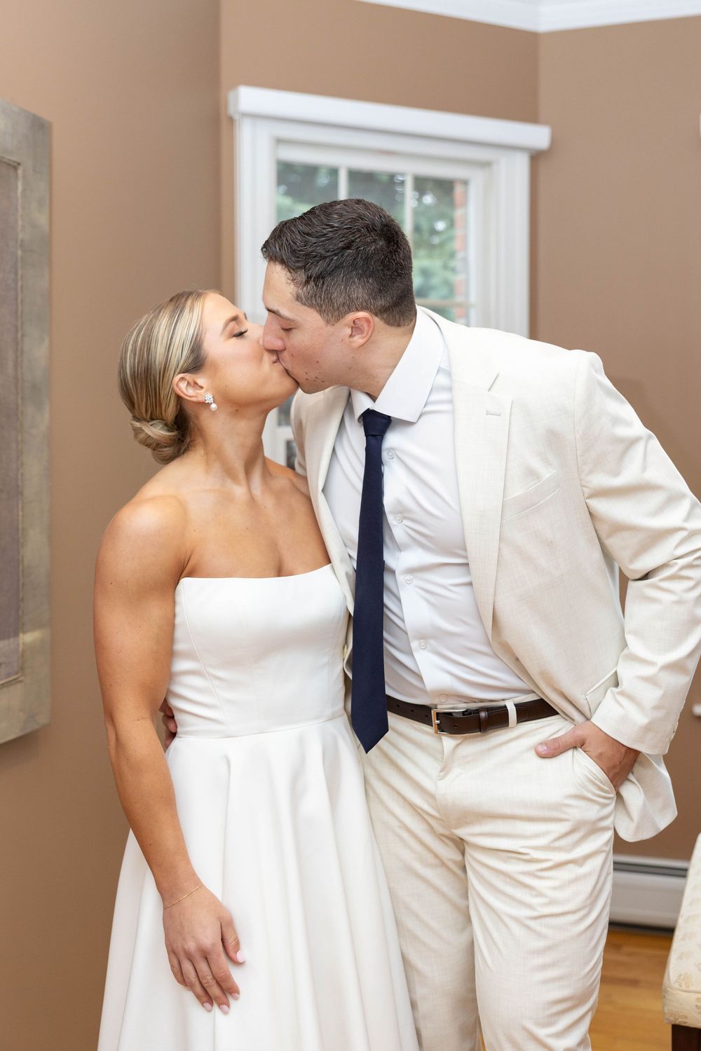 A romantic sequence of wedding photos showing a couple in white attire sharing tender moments together.