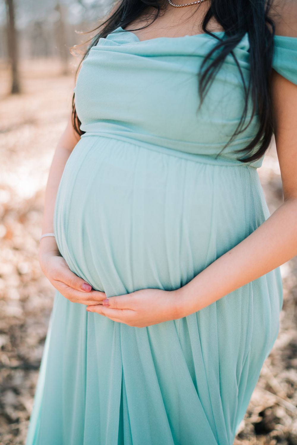 February maternity portraits in the forest. Copyright Two Birds Photography 2026.