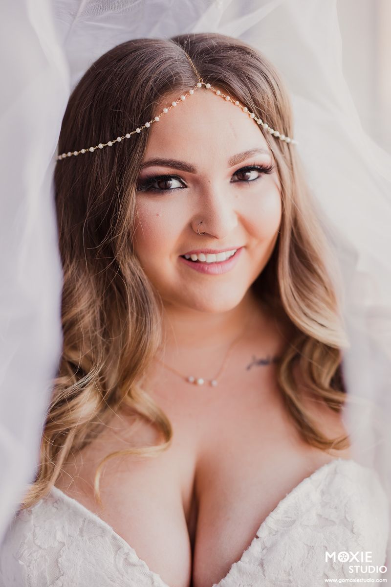 Bridal portrait series showing a bride in a white lace gown with delicate pearl headpiece.