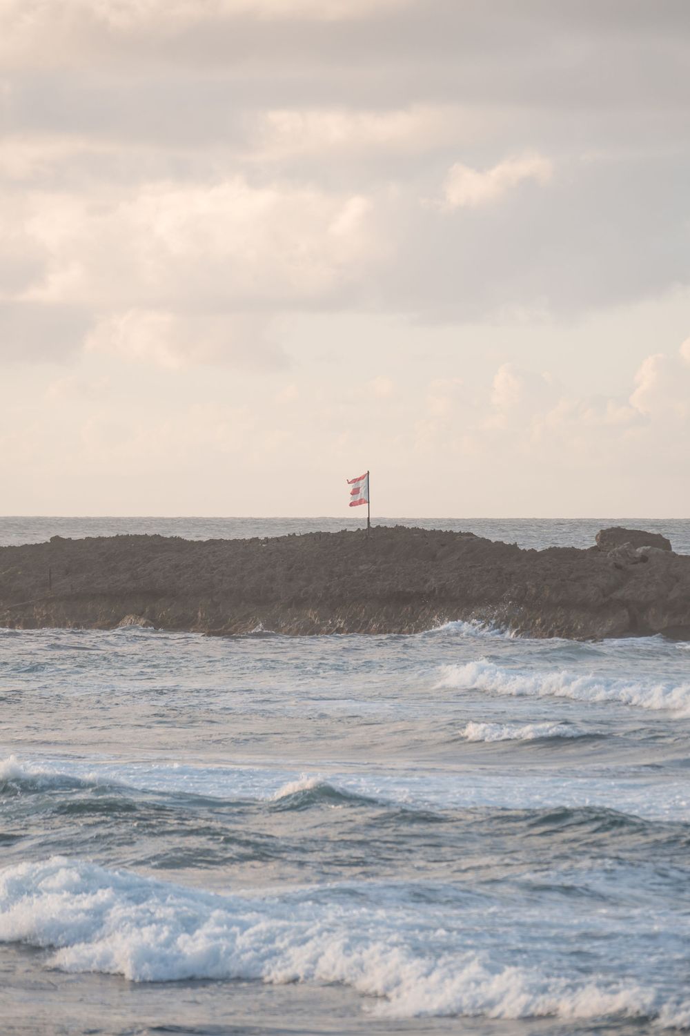 Wide view of ocean and coastline during sunset in Puerto Rico
