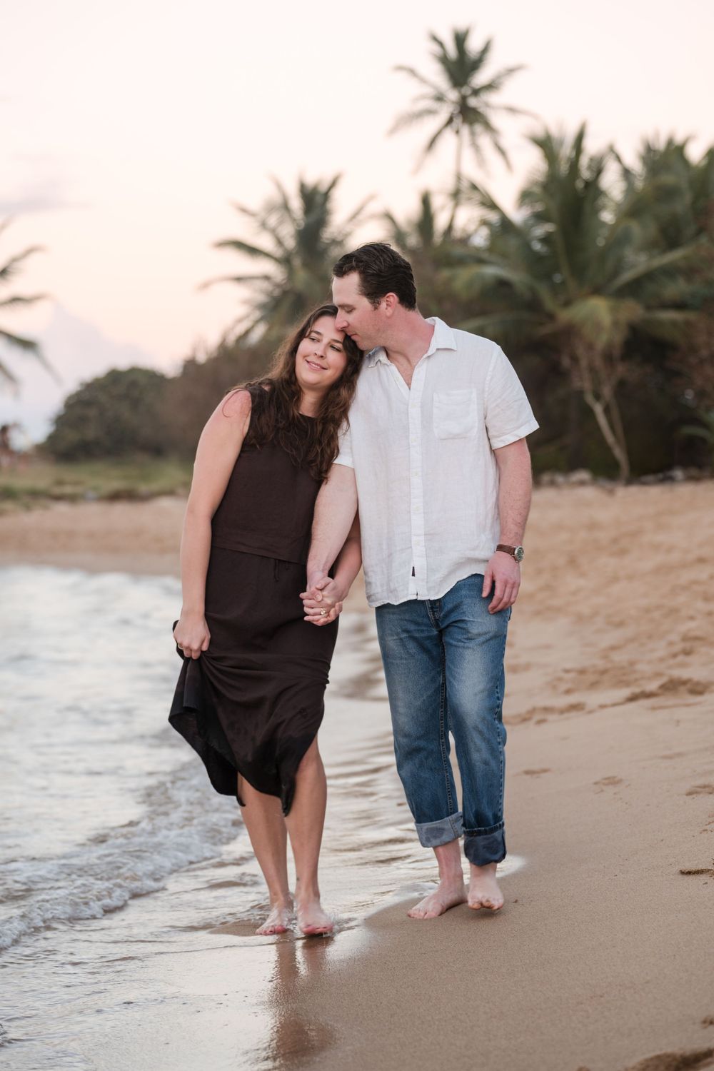 Couple walking side by side on beach during engagement session in Puerto Rico