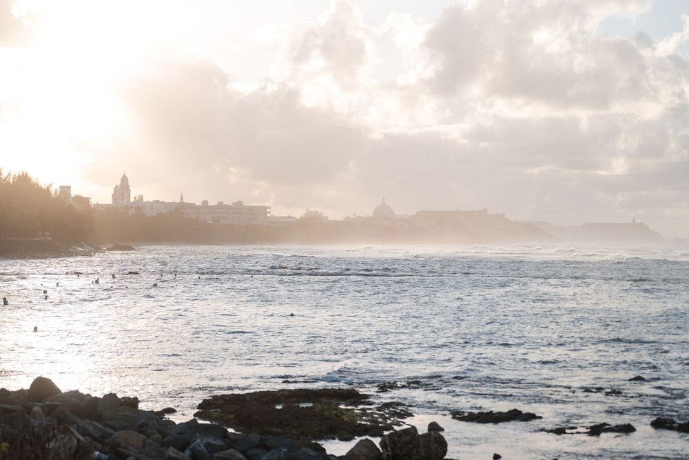 Ocean waves and rocky shoreline during sunset in Puerto Rico