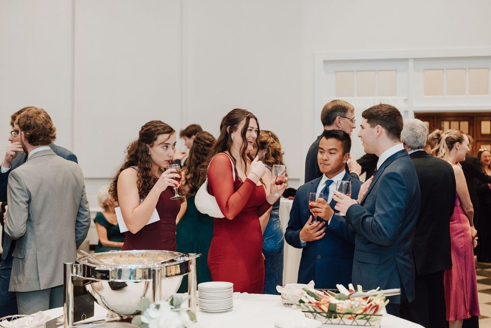 Yorktowne Hotel wedding in York, PA – candid photos of guests during cocktail hour – elegant winter wedding