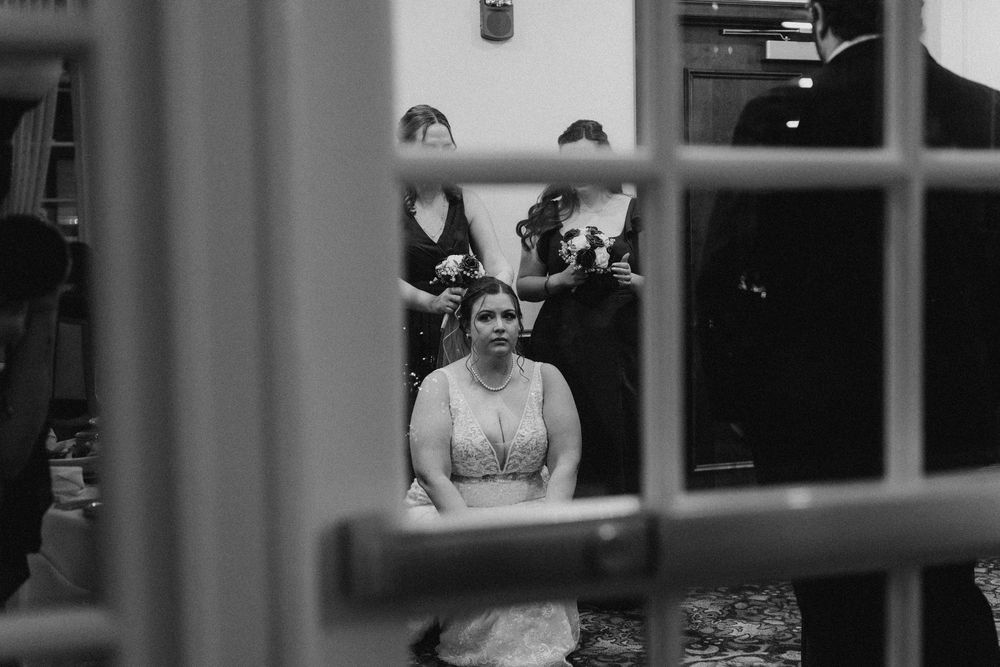 Yorktowne Hotel wedding in York, PA – candid of bride and bridesmaids before wedding reception– elegant winter wedding