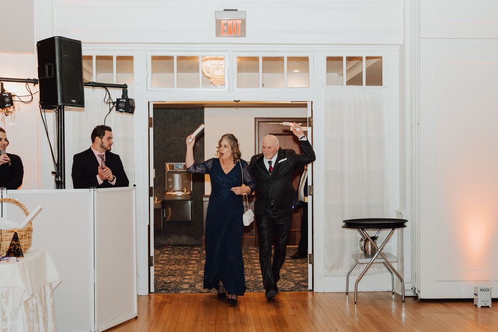 Yorktowne Hotel wedding in York, PA – candid photos of parents of bride and groom during wedding reception for elegant winter wedding