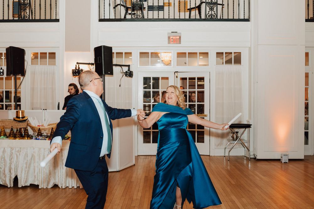 Yorktowne Hotel wedding in York, PA – candid photos of parents of bride and groom during wedding reception for elegant winter wedding
