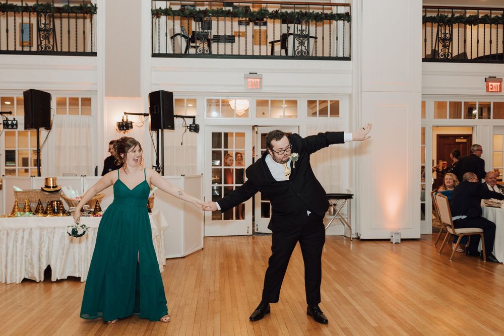Yorktowne Hotel wedding in York, PA – candid photos bridesmaid and groomsmen during wedding reception for elegant winter wedding