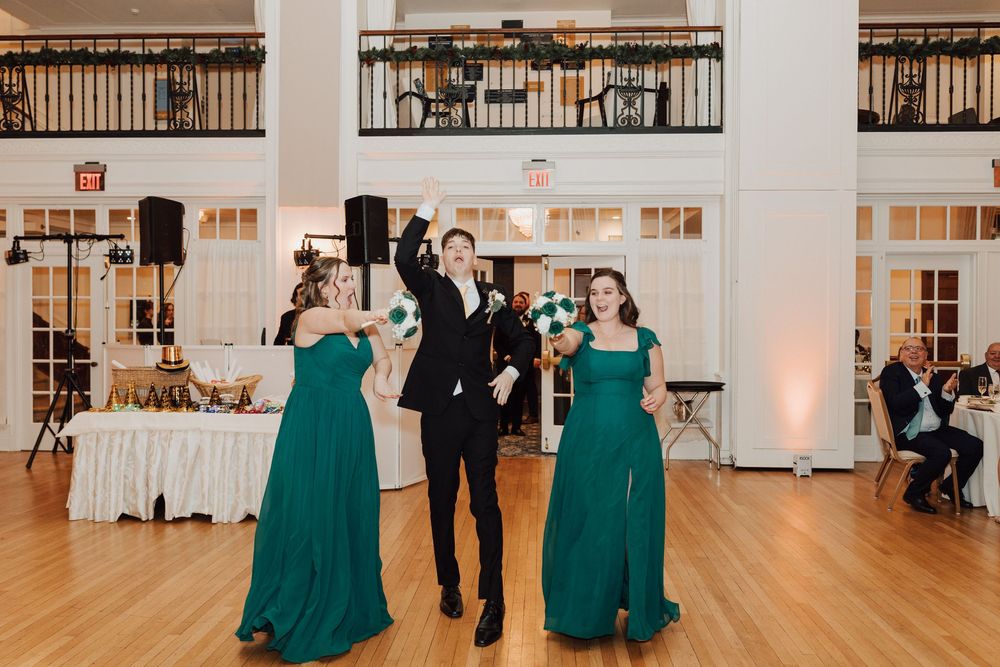 Yorktowne Hotel wedding in York, PA – candid photos bridesmaid and groomsmen during wedding reception for elegant winter wedding