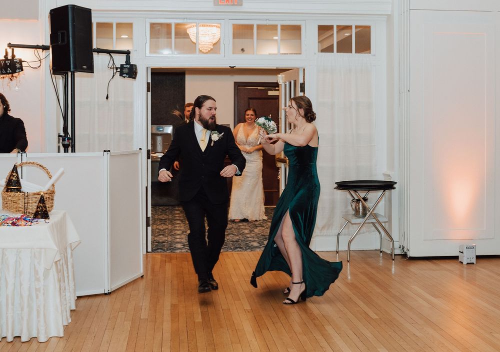 Yorktowne Hotel wedding in York, PA – candid photos bridesmaid and groomsmen during wedding reception for elegant winter wedding