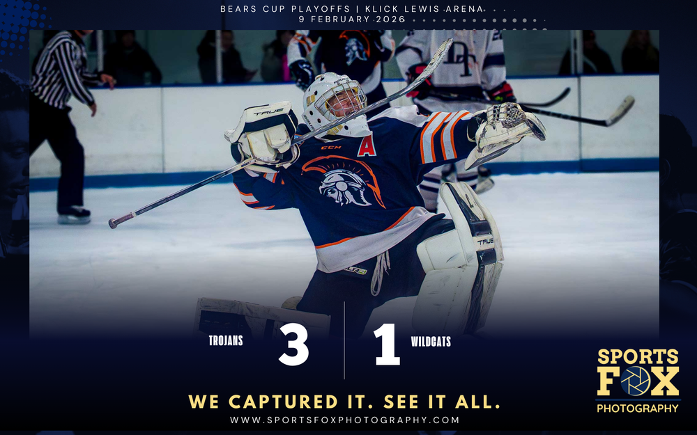 Trojans goalie raises arms in triumph after the victory, scoreboard overlay: Trojans 3, Wildcats 1, SportsFox Photography logo.