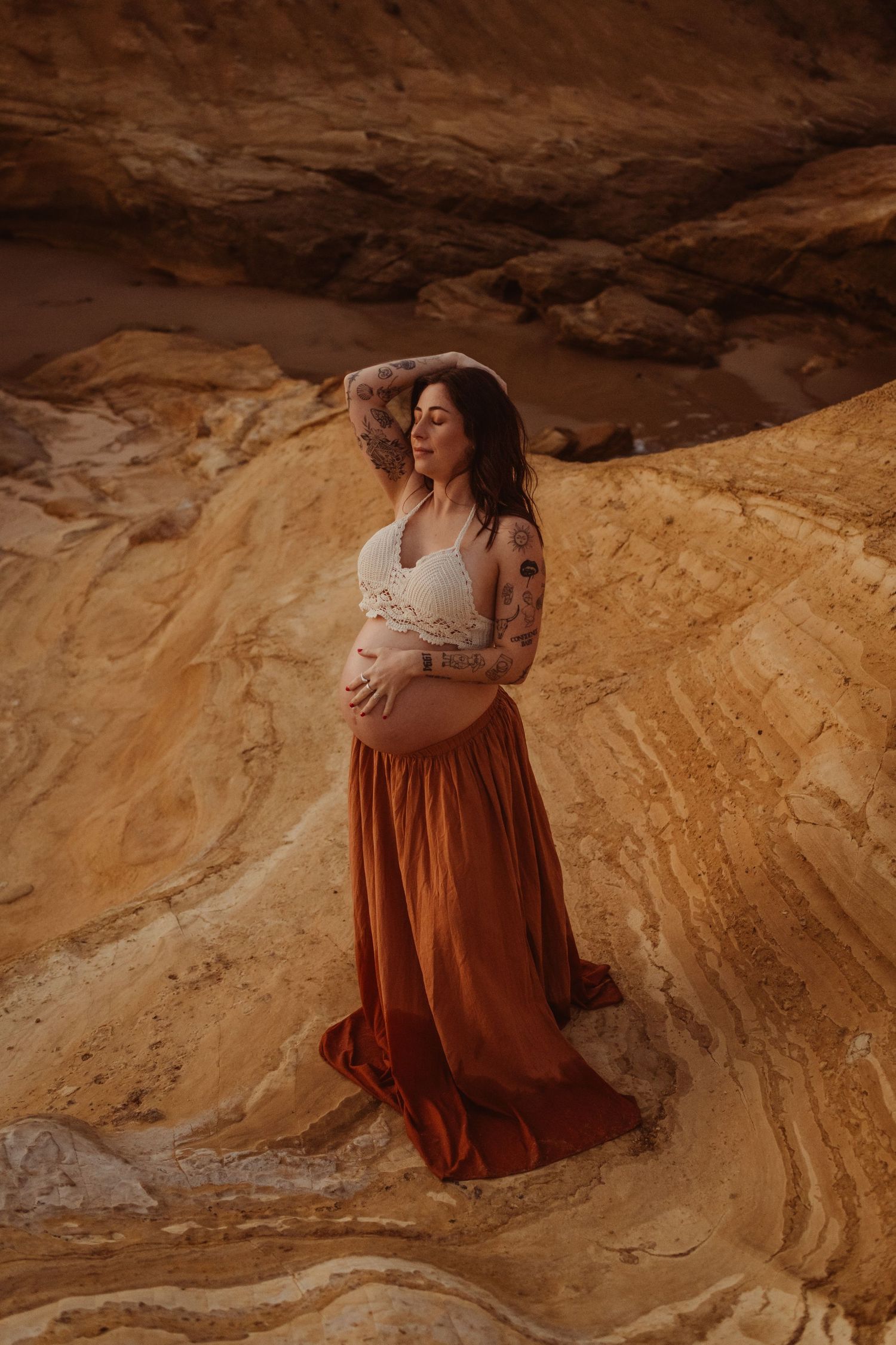 Photoshoot of Crochet halter top on maternity model at a Surfcoast Beach during sunset. Geelong, Australia