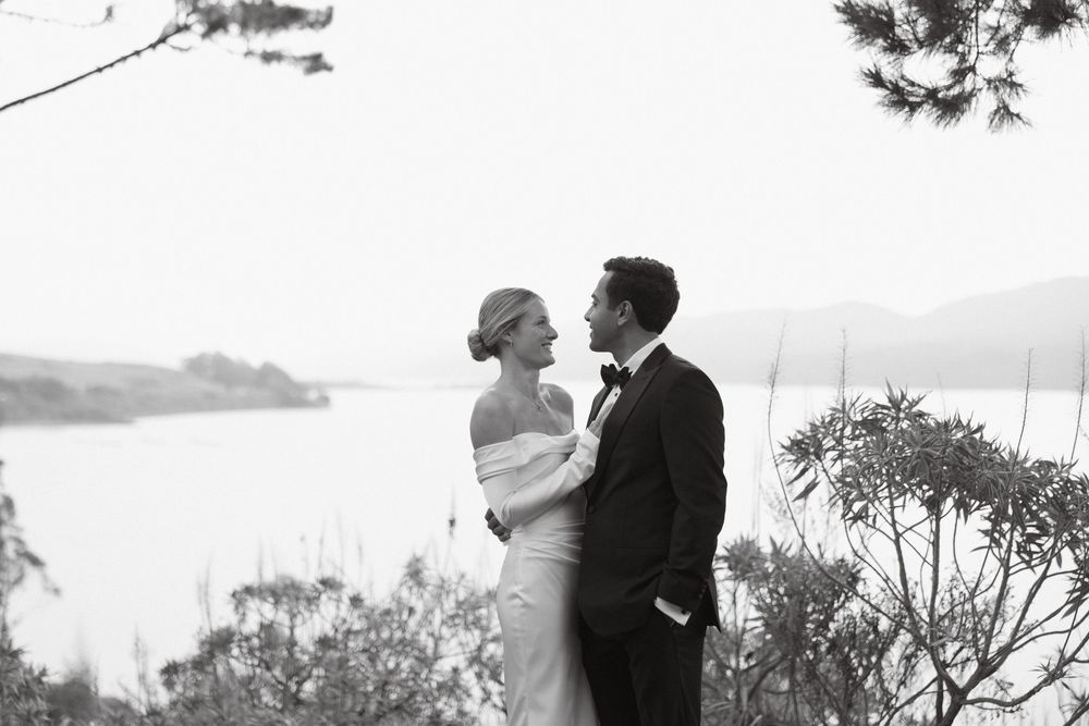 Black and white couple portrait overlooking Tomales Bay in Northern California with a timeless, romantic feel