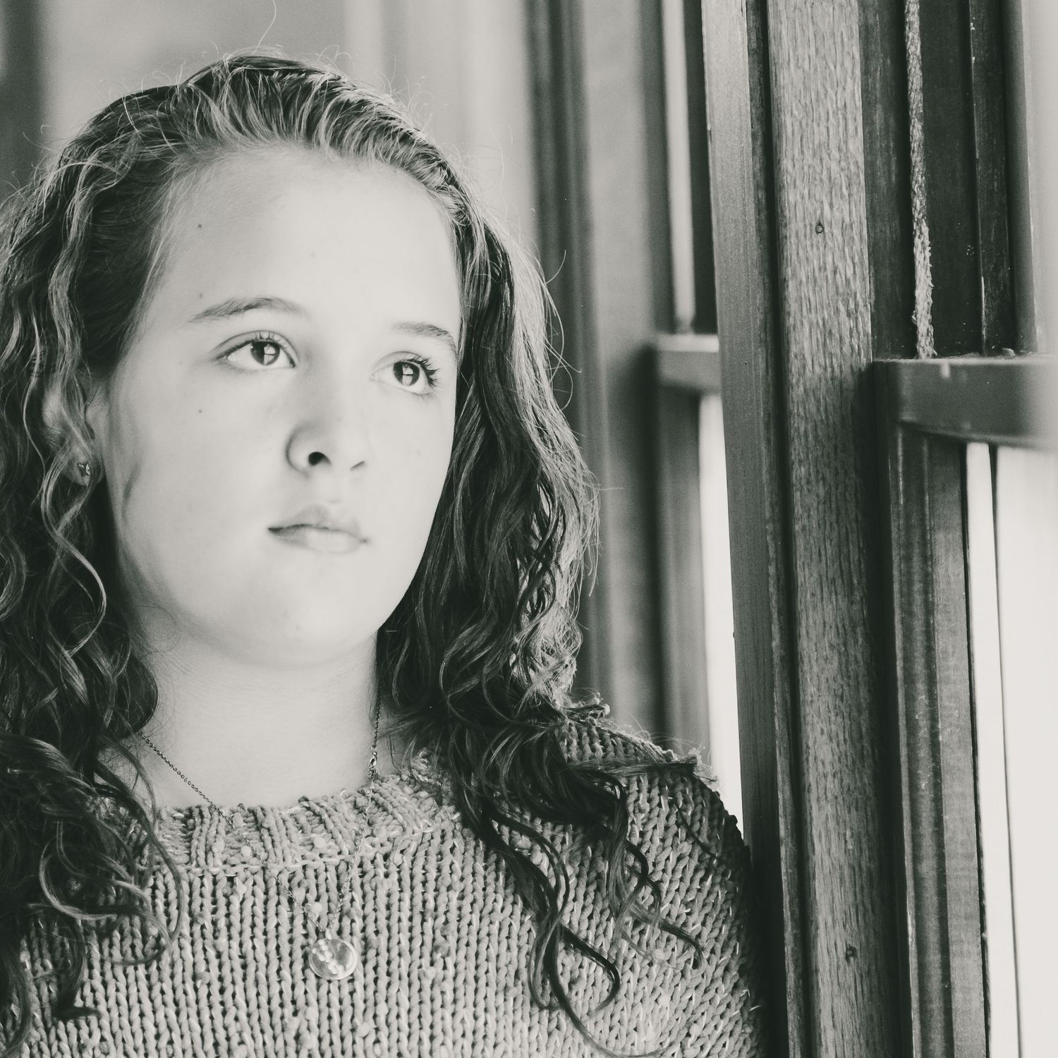 Black and white portrait series showing different angles in natural light.