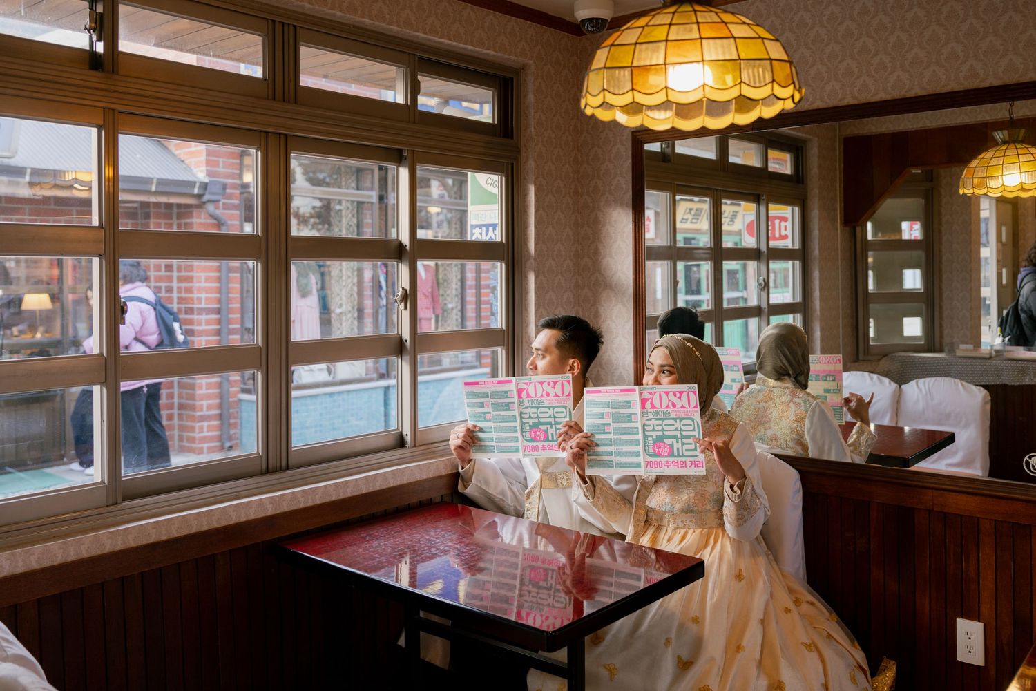 Vintage Japanese restaurant interior with warm lighting, wooden decor, and traditional dining spaces creates cozy ambiance.