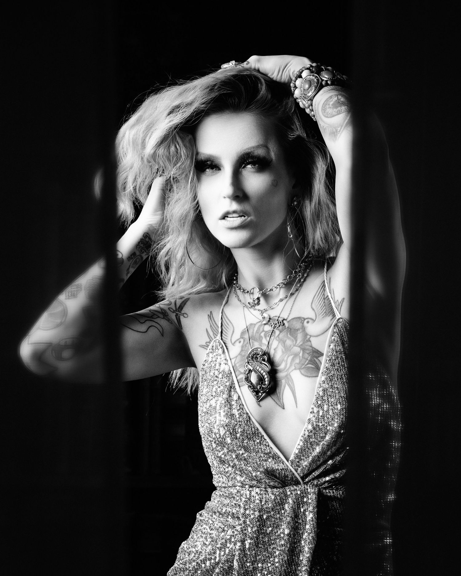 David G Holt Photography - Glamorous black and white portrait in sparkly dress with dramatic hair styling.