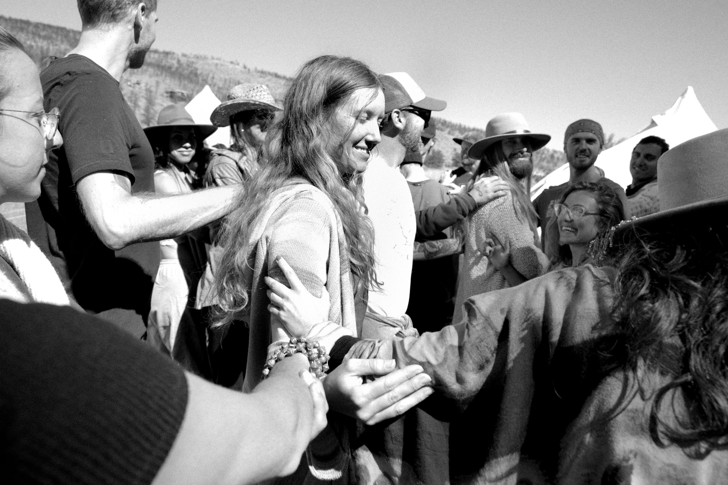 Black and white photo of crowd gathered at outdoor celebration.