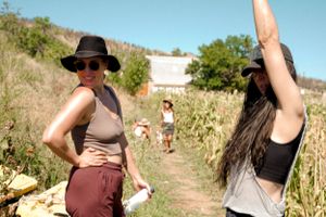 Summer adventurers exploring a scenic hiking trail surrounded by lush vegetation.