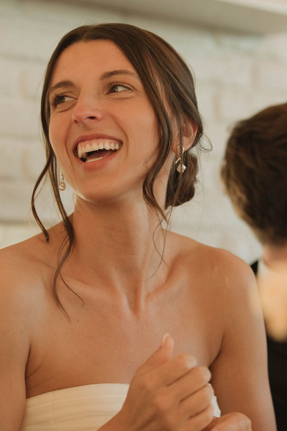 Candid moments of joy and laughter during an elegant wedding reception.