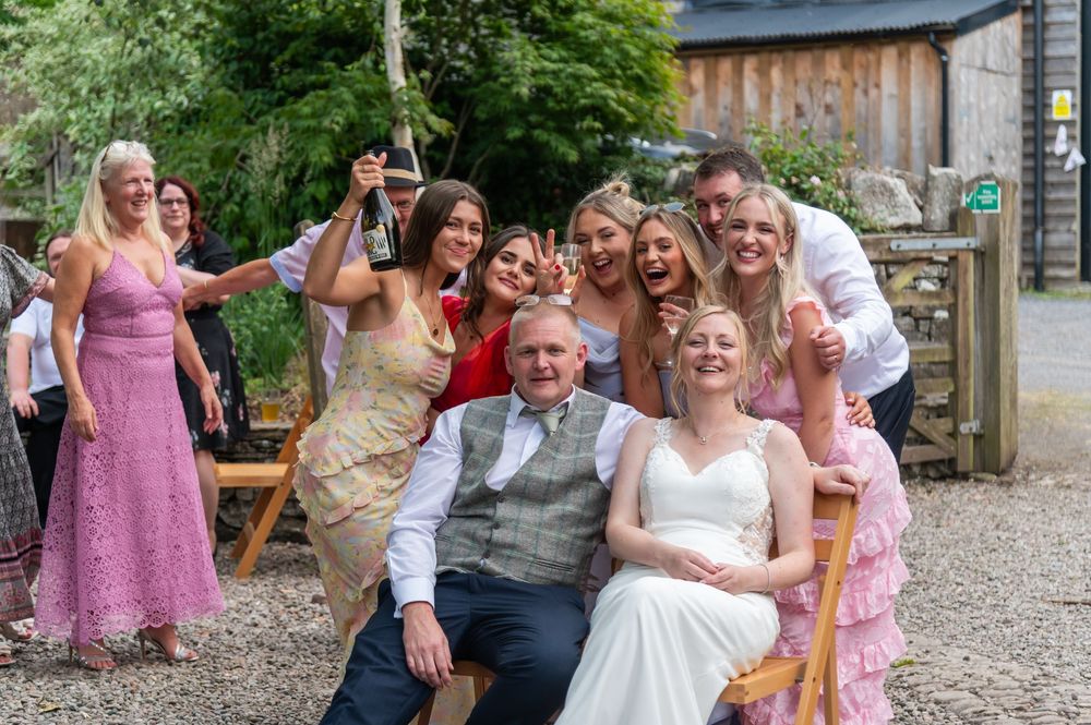 Candid moments of wedding guests celebrating and laughing outdoors.