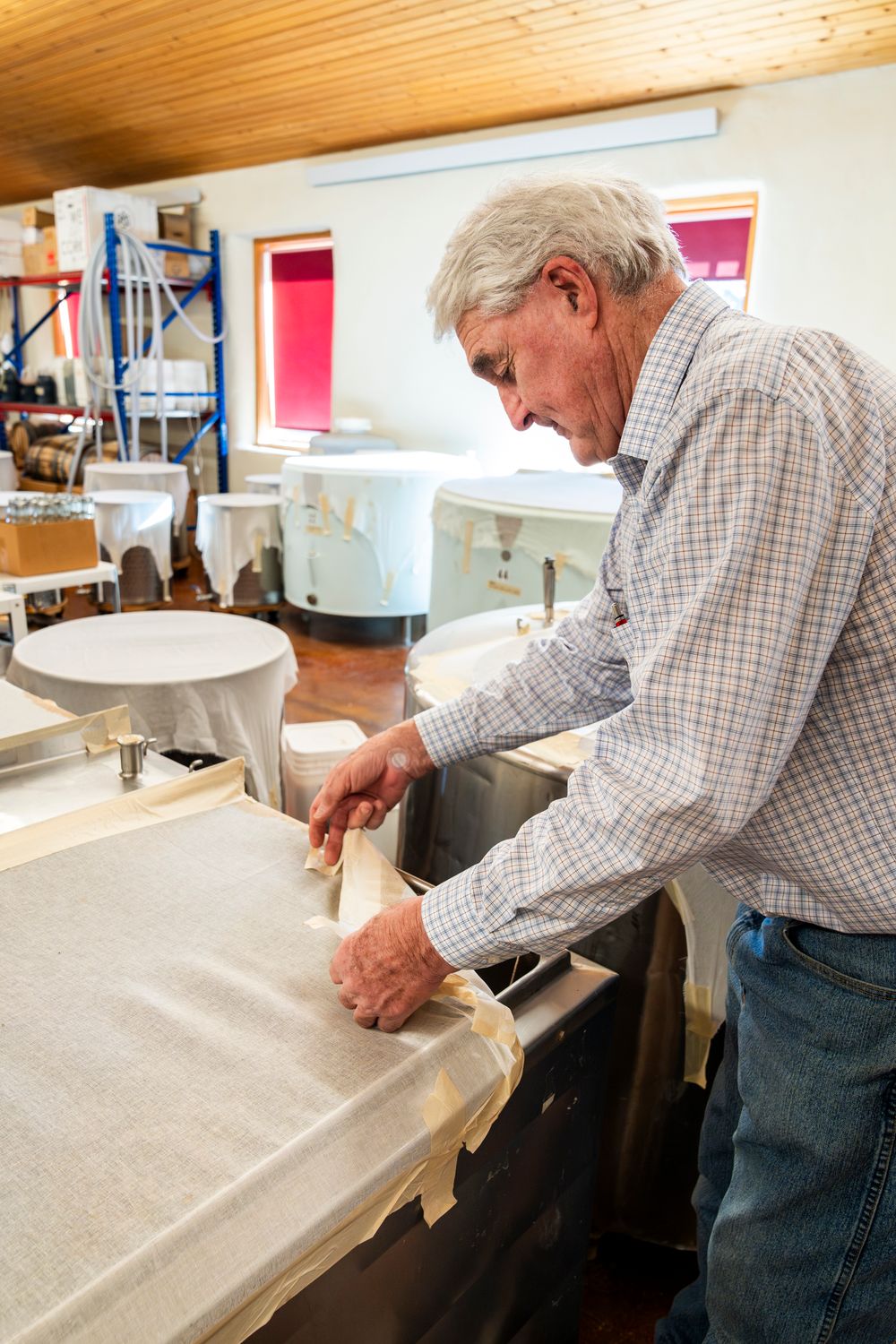 Manufacturing process showing layered industrial equipment and production materials.