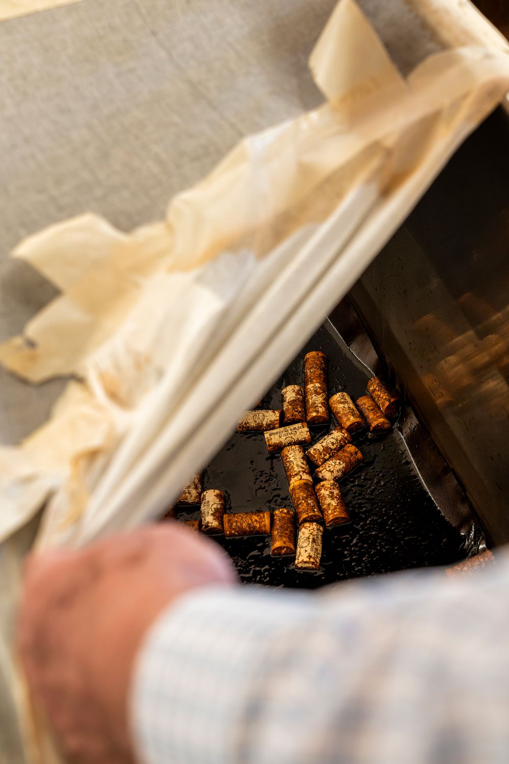 Close-up view of cork materials used in vinegar bottle production.
