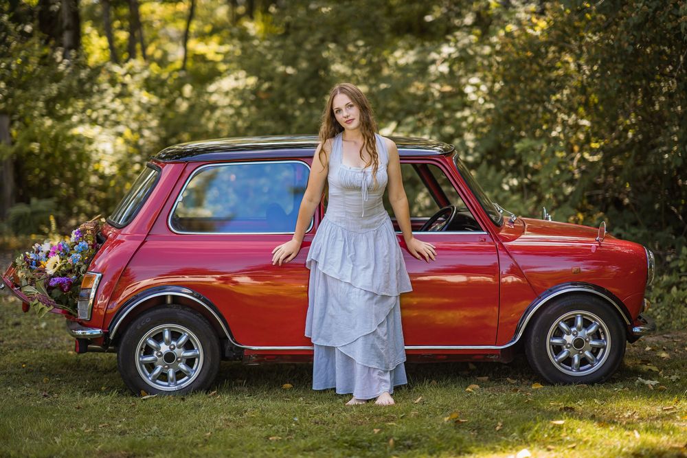styled photography senior mini session with red classic mini Cooper car and seasonal flowers