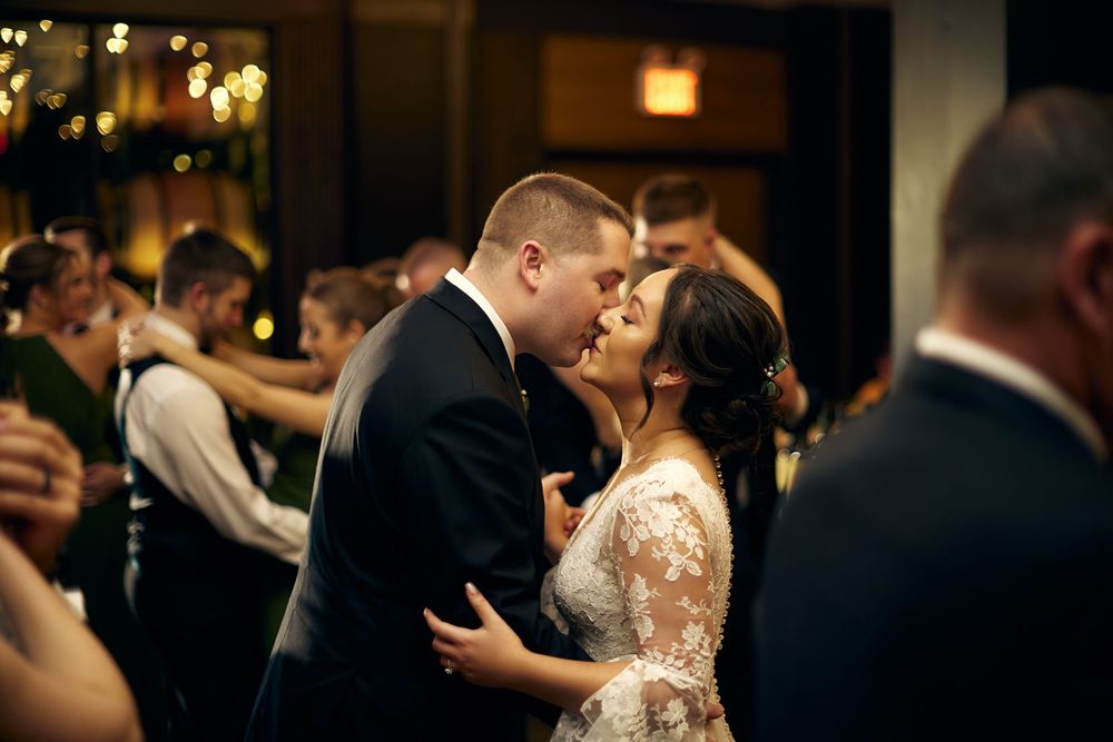 A couple shares a romantic dance moment at their wedding reception.