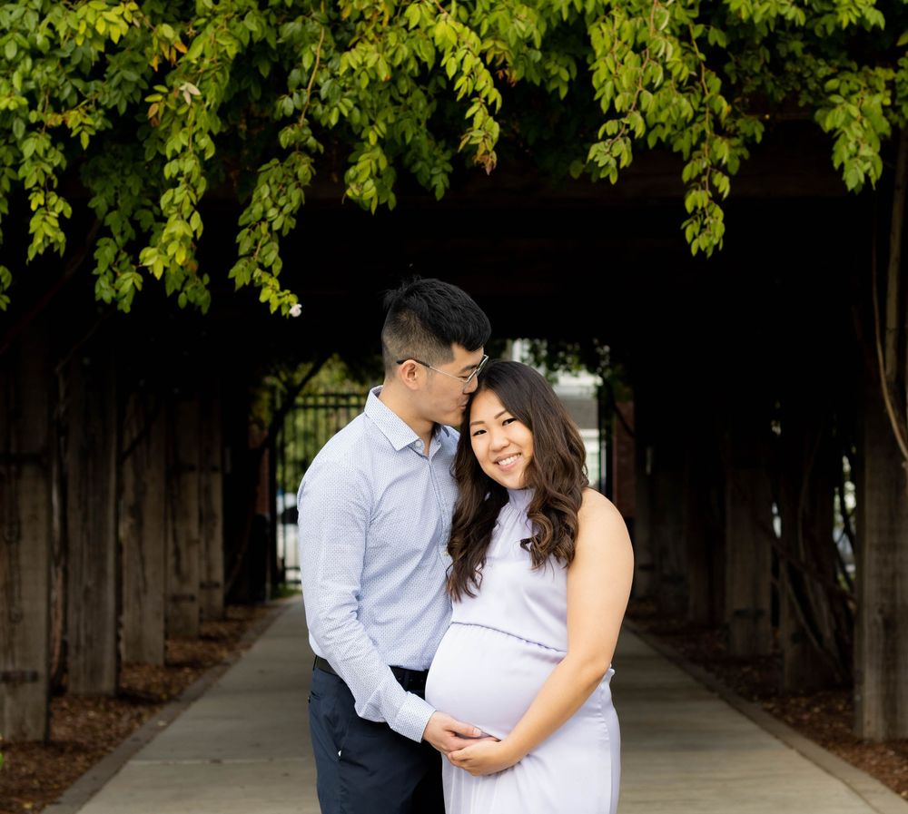 Expectant couple posing for a maternity photo together outdoors, Bay Area, CA