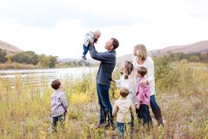Candid family moments captured in a natural outdoor setting.