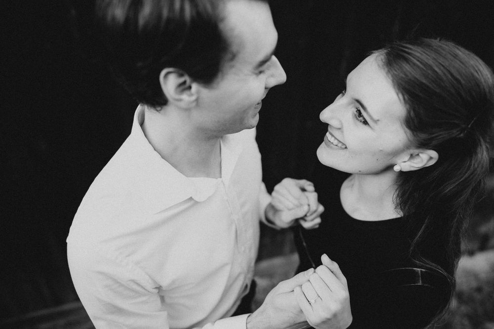 Intimate black and white portraits capturing romantic moments between couple.