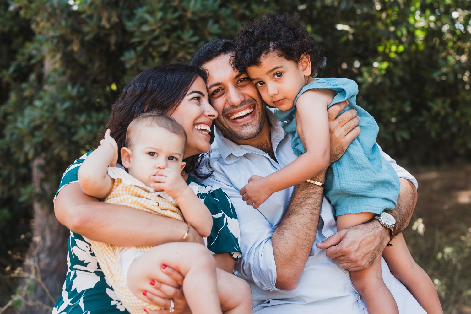 A cheerful family moment captured outdoors in natural lighting.
